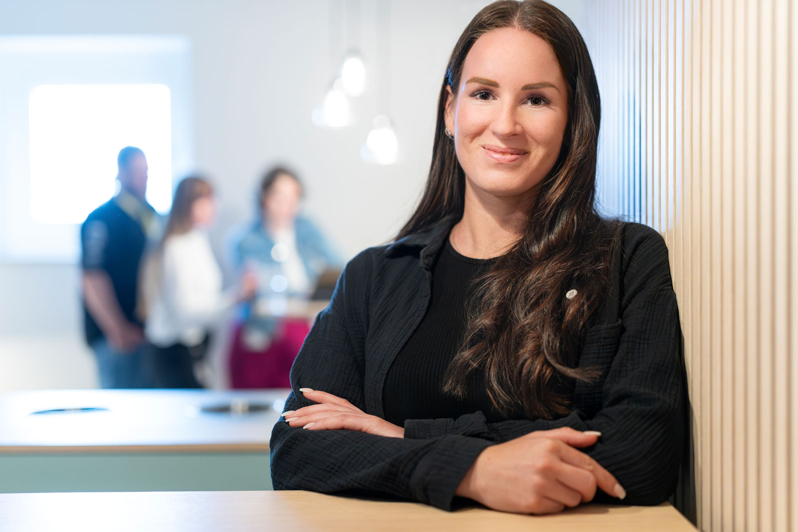 Our colleague Fabienne leaning on the table
